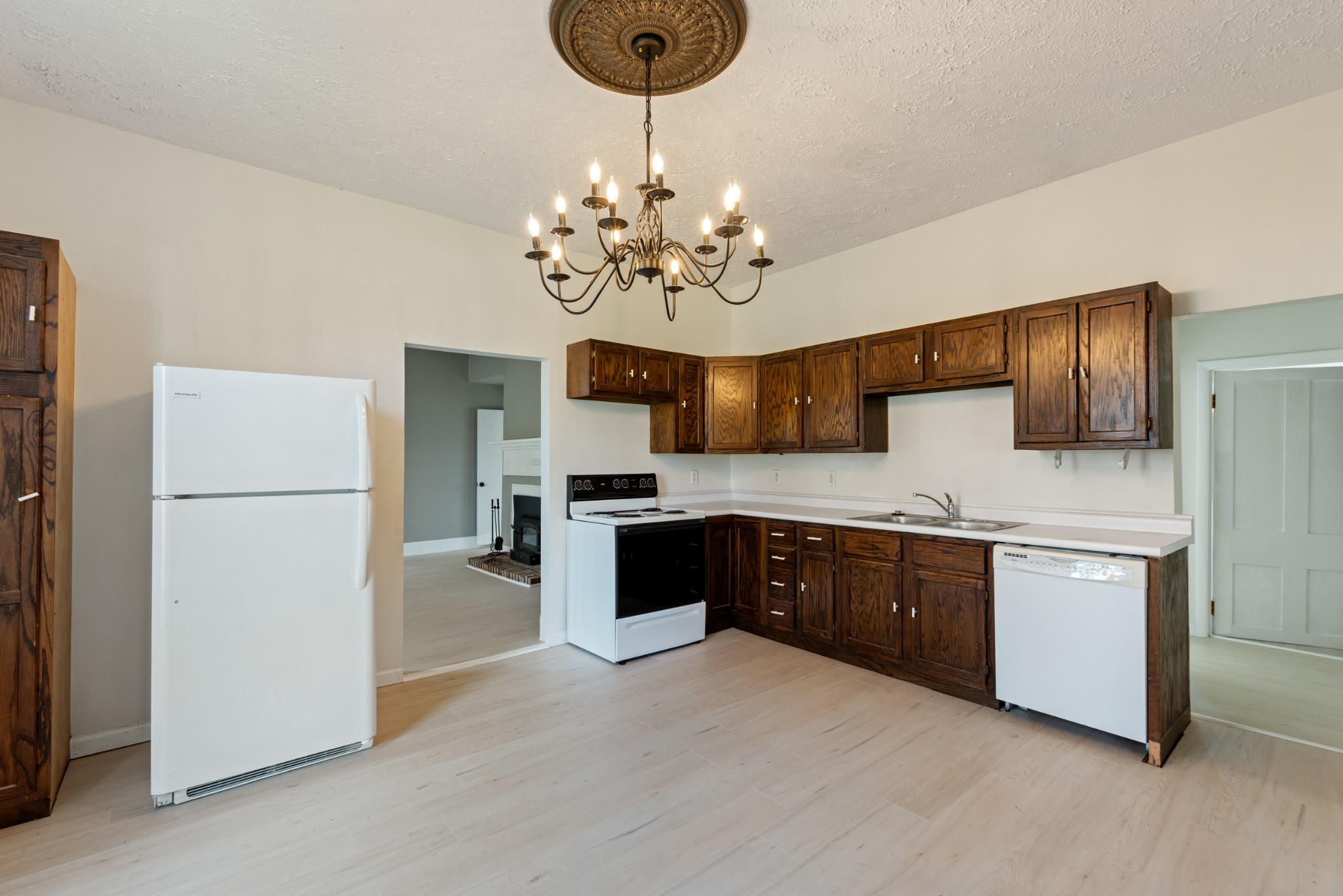 126 West End Avenue Centerville, TN 37033 - Photo 16 of 37 a large kitchen with stainless steel appliances granite countertop a refrigerator a sink dishwasher a oven with a dining table and chairs