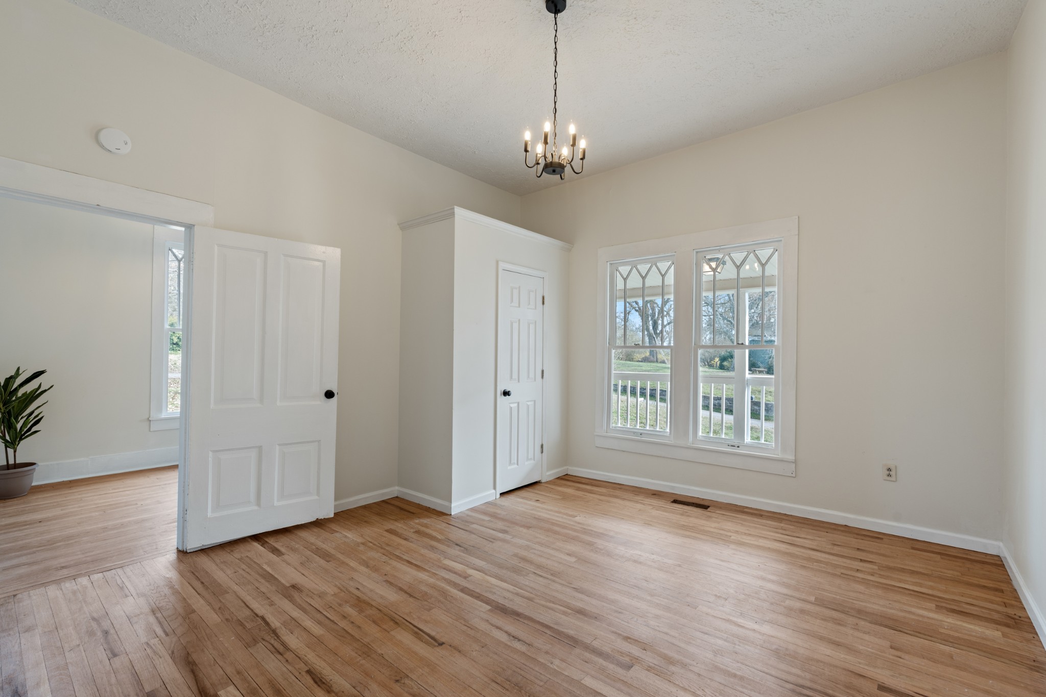126 West End Avenue Centerville, TN 37033 - Photo 25 of 37 a view of an empty room with wooden floor and a window