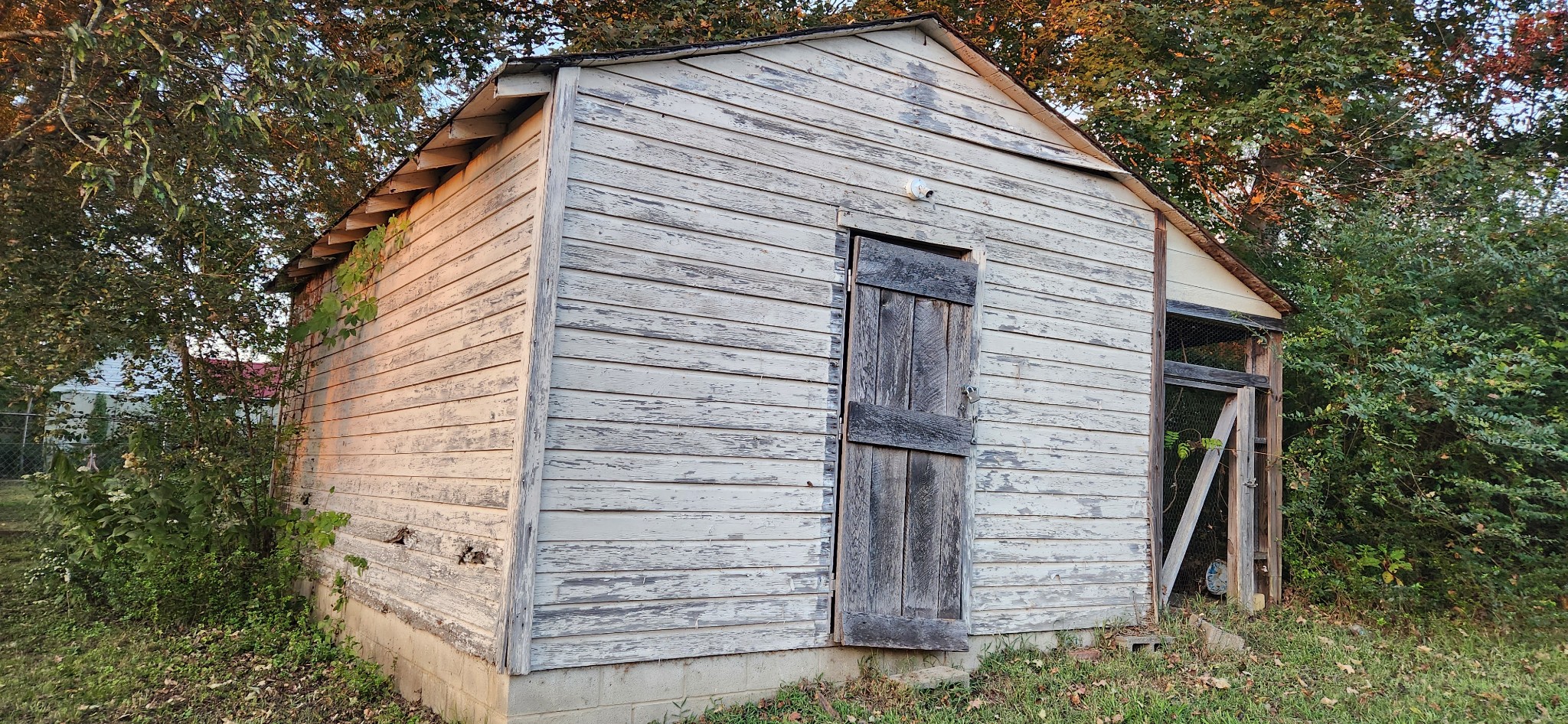 126 West End Avenue Centerville, TN 37033 - Photo 27 of 28 a view of wooden house with large windows and a tree
