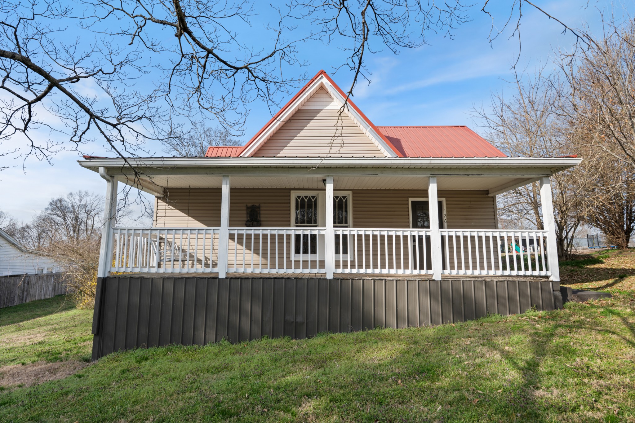 126 West End Avenue Centerville, TN 37033 - Photo 3 of 37 a view of a house with a yard and a fence