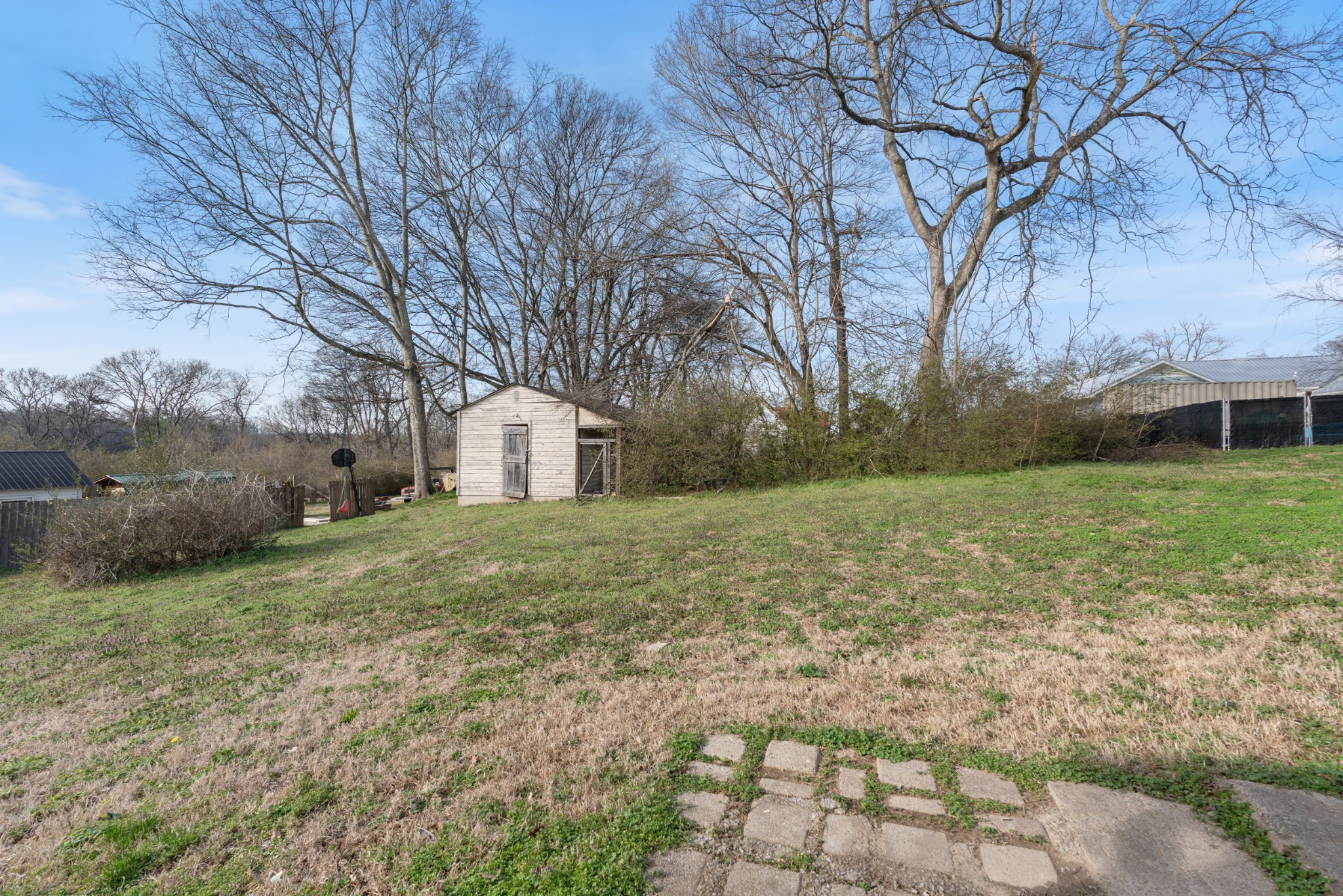 126 West End Avenue Centerville, TN 37033 - Photo 37 of 37 a view of a yard with a house and large trees
