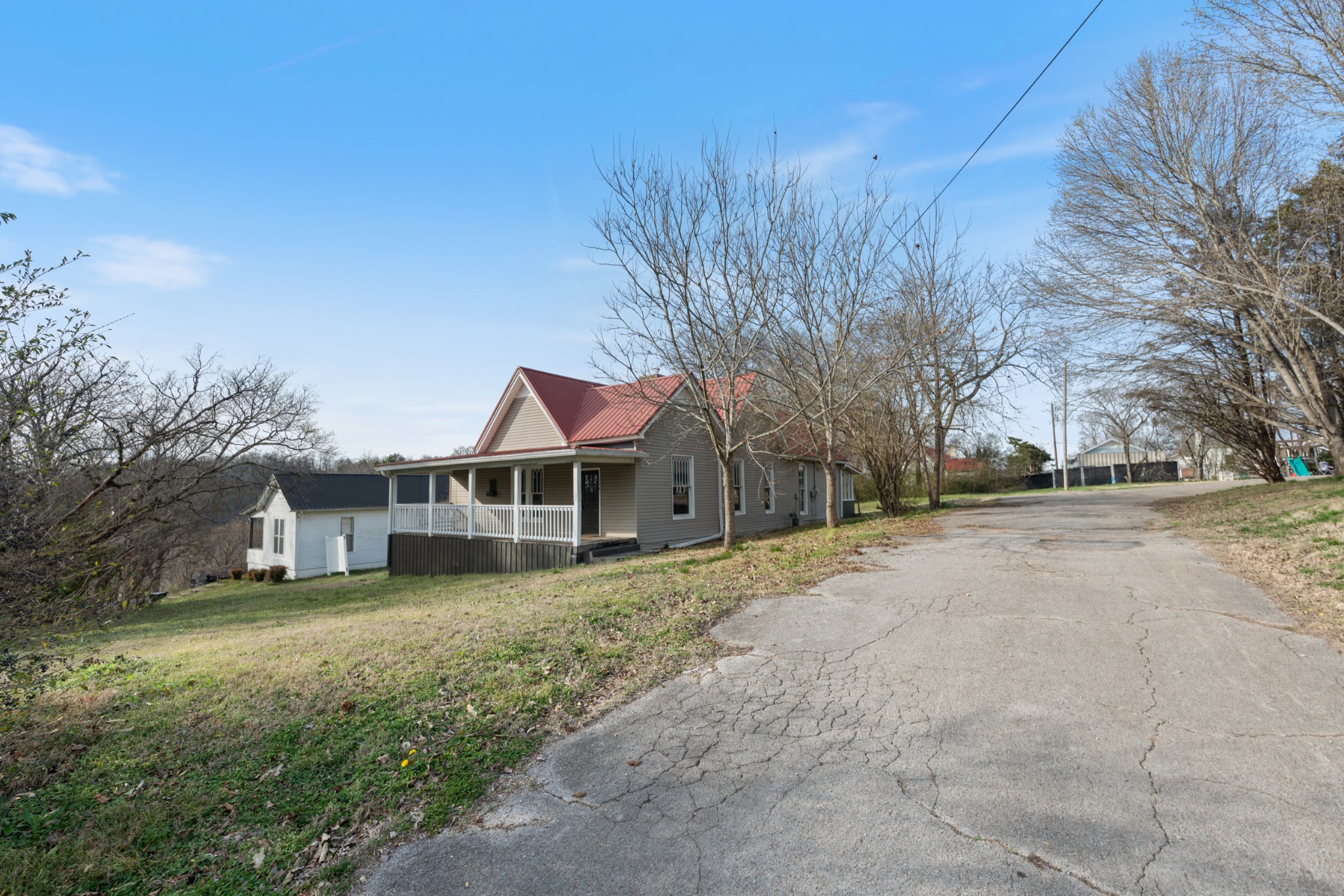 126 West End Avenue Centerville, TN 37033 - Photo 5 of 37 a front view of a house with a yard and trees