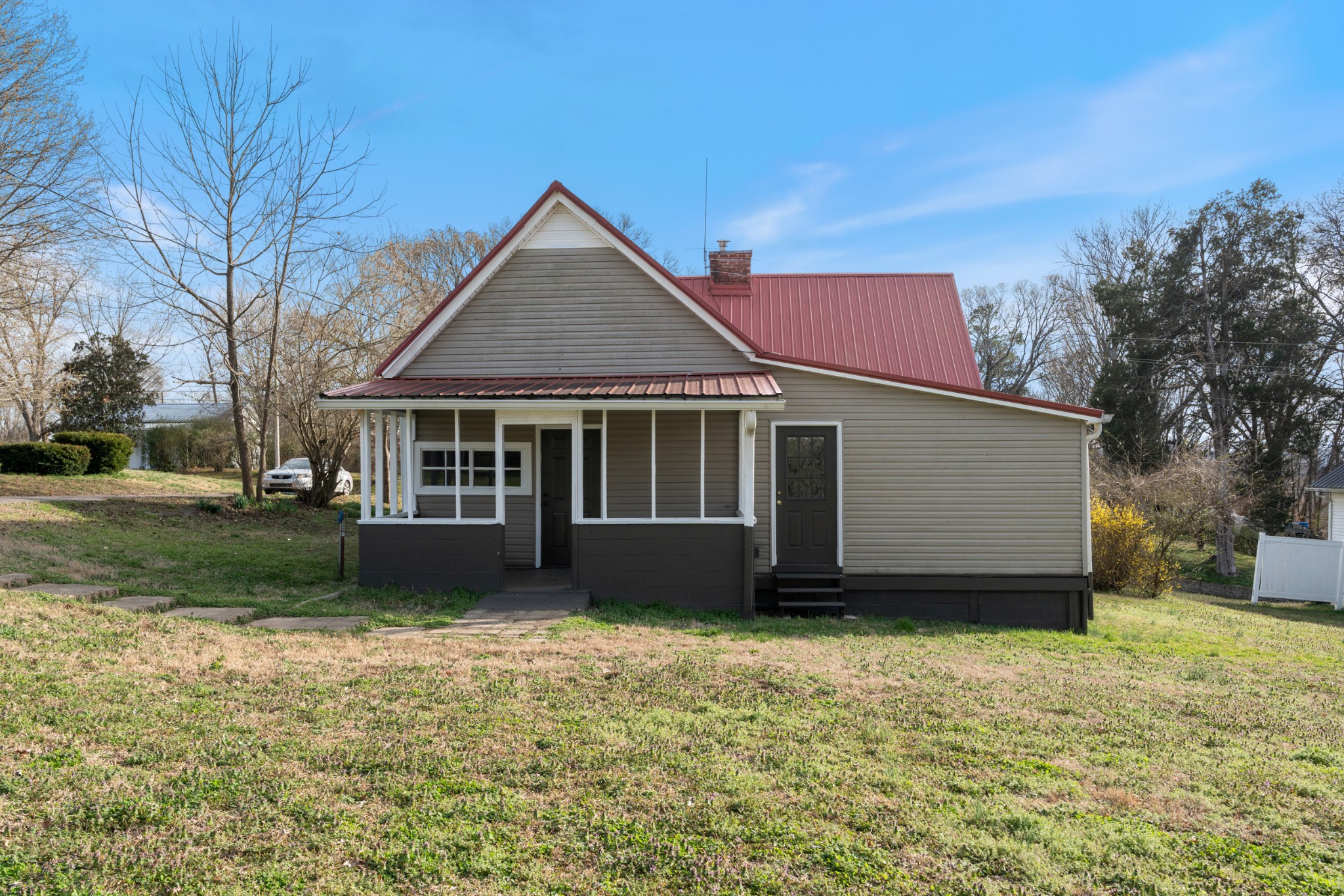 126 West End Avenue Centerville, TN 37033 - Photo 7 of 37 a front view of a house with a garden