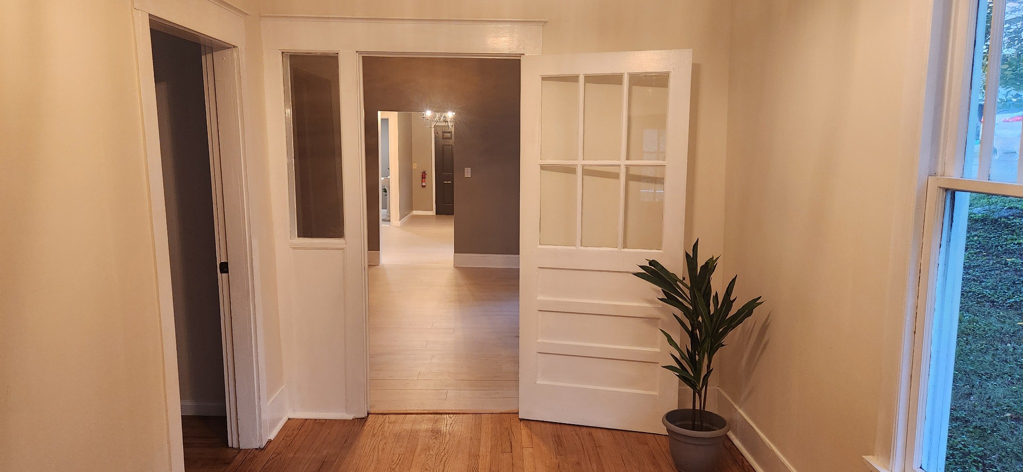 126 West End Avenue Centerville, TN 37033 - Photo 9 of 28 a view of a hallway with wooden floor and a potted plant