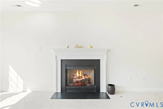 a dining room with furniture a chandelier and wooden floor