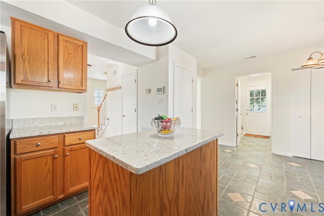 3908 Trickling Brook Drive Henrico, VA 23228 - Photo 19 of 47 Kitchen with light ganite countertops, brown cabin