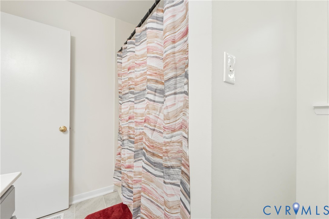 3908 Trickling Brook Drive Henrico, VA 23228 - Photo 27 of 47 Bathroom with vanity, light tile patterned floors,