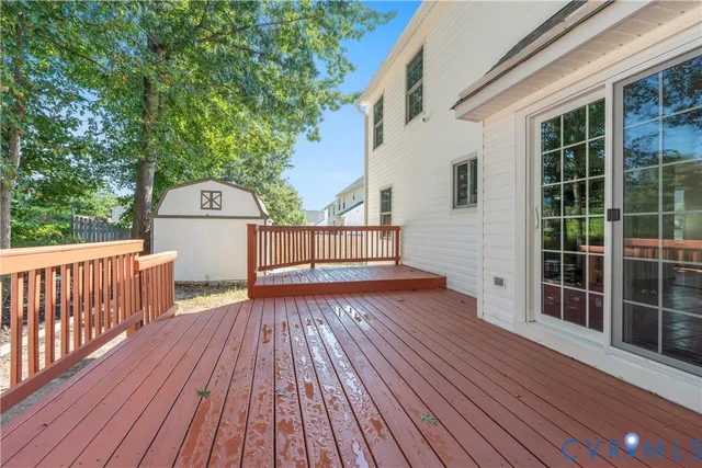 a backyard of a house with barbeque oven and trees