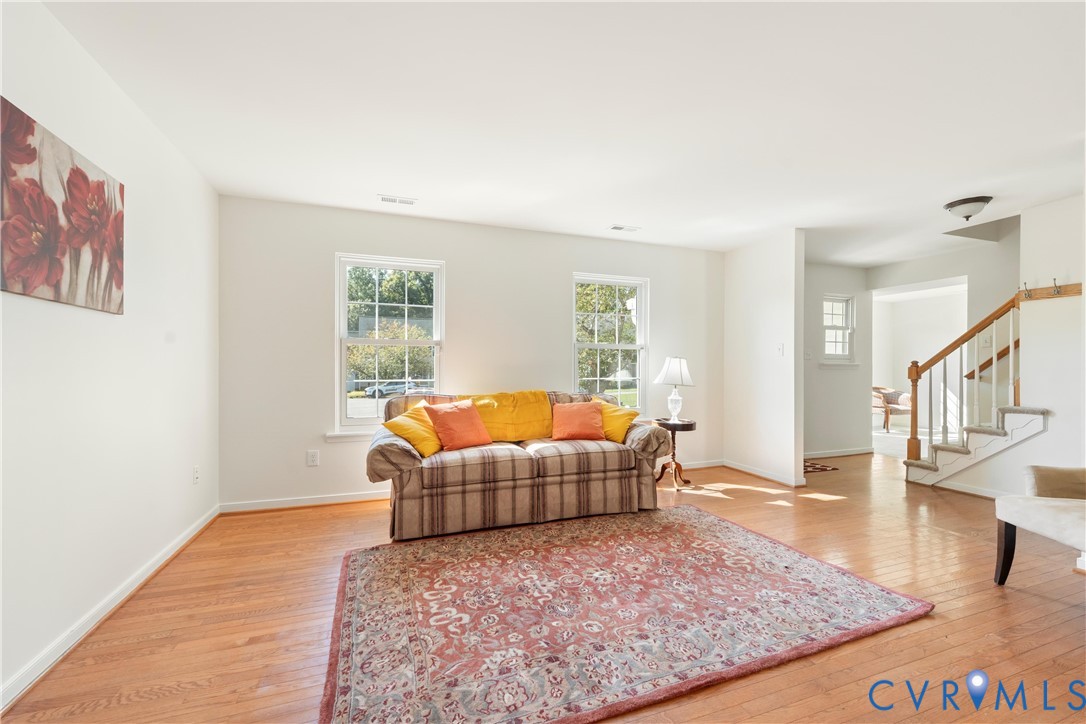 3908 Trickling Brook Drive Henrico, VA 23228 - Photo 9 of 47 Living area featuring stairs and light wood-style