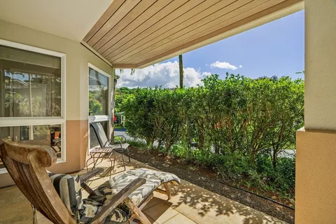 a view of a patio with table and chairs and potted plants
