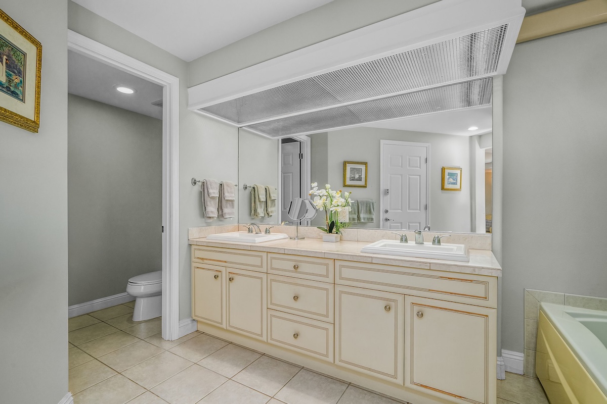 4141 Lei O Papa Road, Unit 33 Princeville, HI 96722 - Photo 14 of 22 a bathroom with a double vanity sink and a mirror