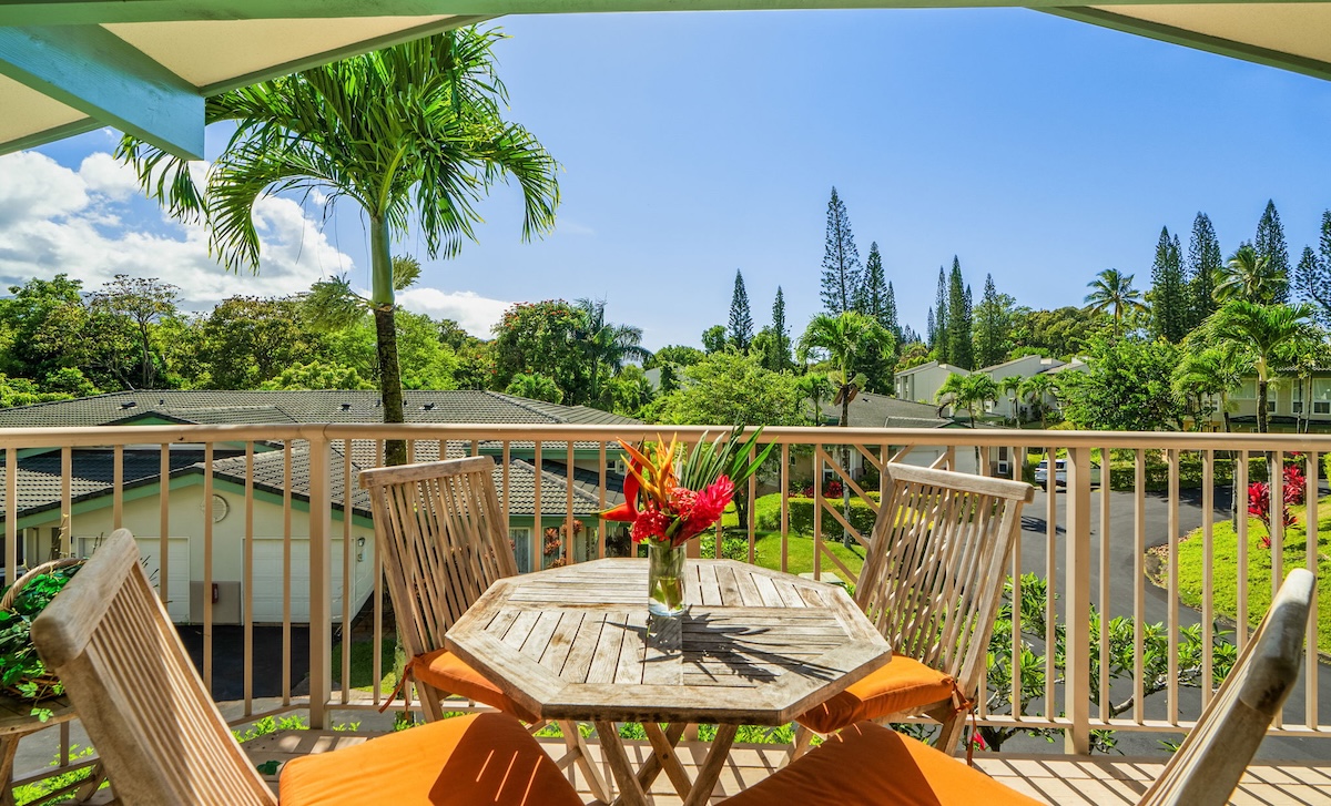 4141 Lei O Papa Road, Unit 33 Princeville, HI 96722 - Photo 2 of 22 a view of a balcony with chairs and wooden floor