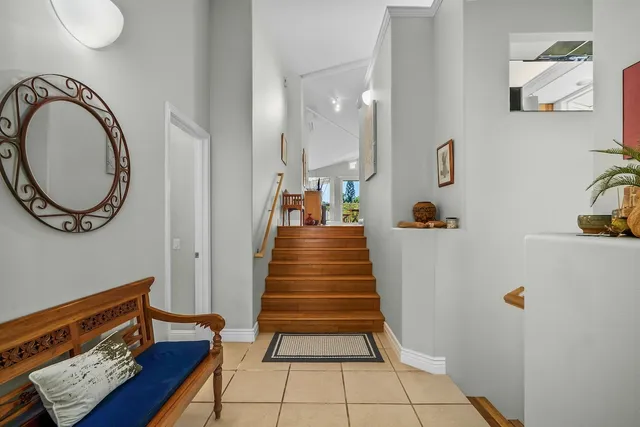 a view of an entryway with wooden floor