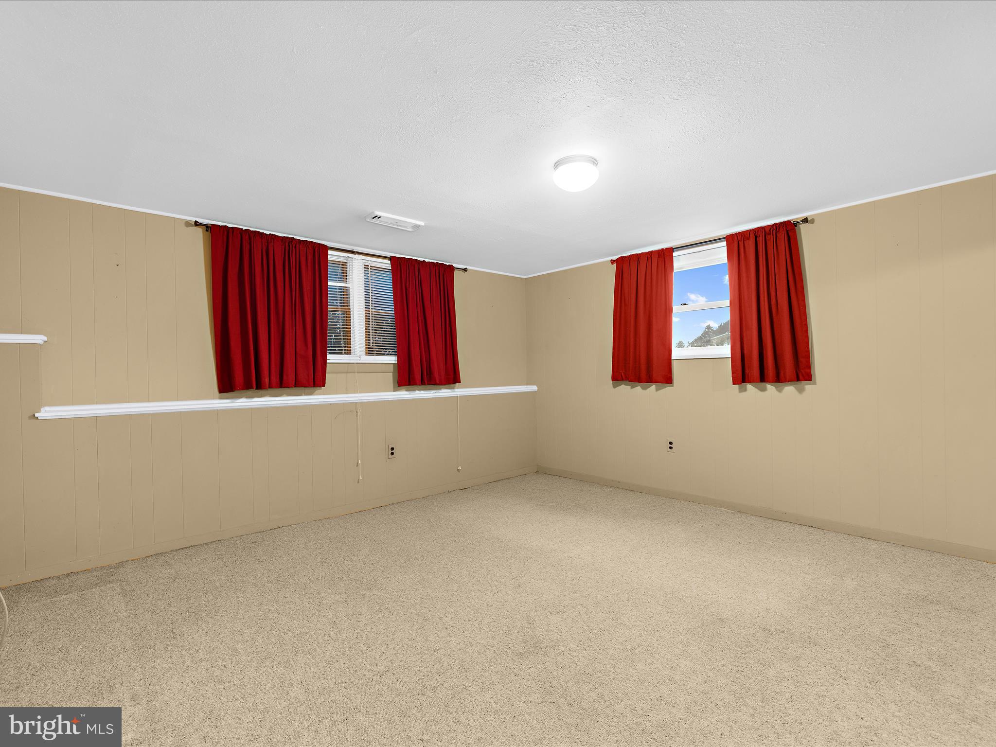 6102 Moorefield Road Baltimore, MD 21228 - Photo 23 of 38 a view of wooden floor and windows in a room