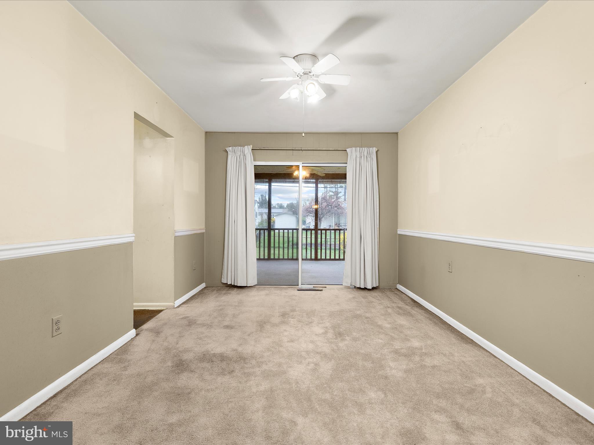 6102 Moorefield Road Baltimore, MD 21228 - Photo 6 of 38 an empty room with windows and closet
