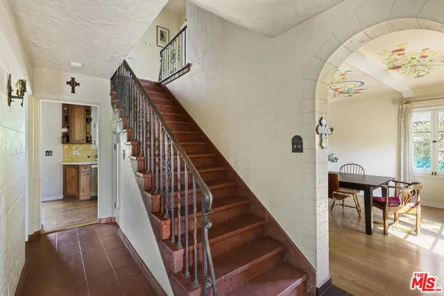 a living room with fireplace furniture and a flat screen tv
