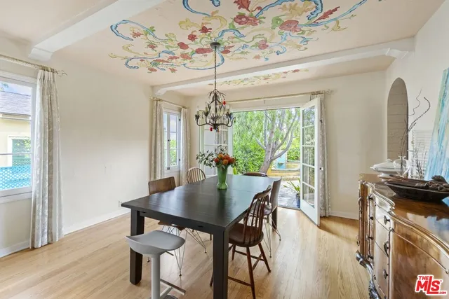 a view of a dining room with furniture window and outside view