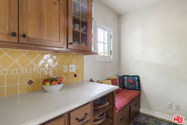 a kitchen with a sink stove and refrigerator
