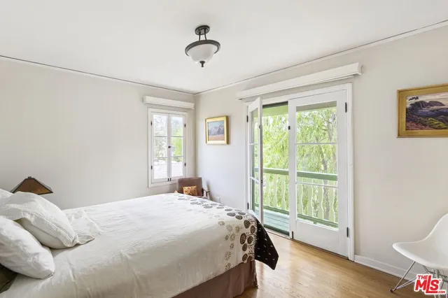 a bathroom with a double vanity sink mirror and toilet
