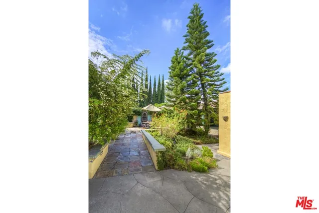 a view of a patio with a table and chairs