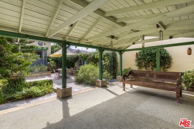 a living room with couch and a dining table