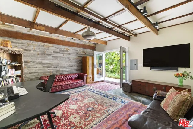 an aerial view of a house with outdoor space patio and swimming pool