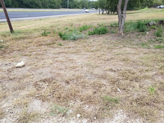 a view of a yard with an empty space