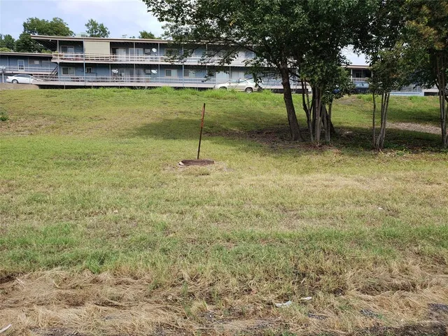 a view of a swimming pool with a yard