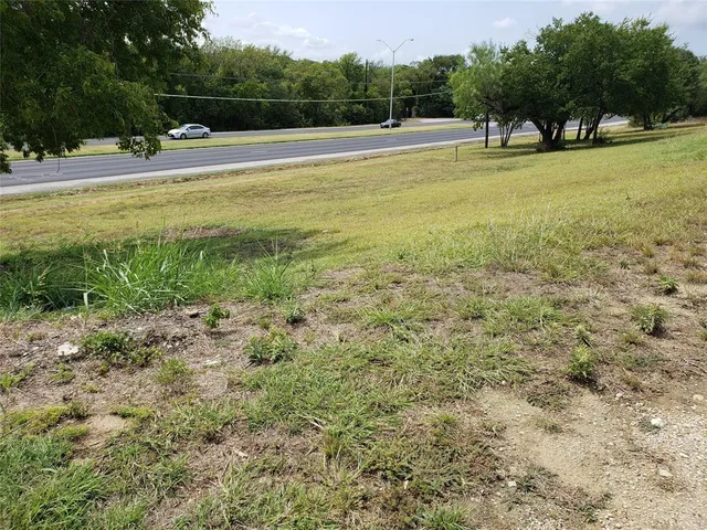 a view of outdoor space with trees all around
