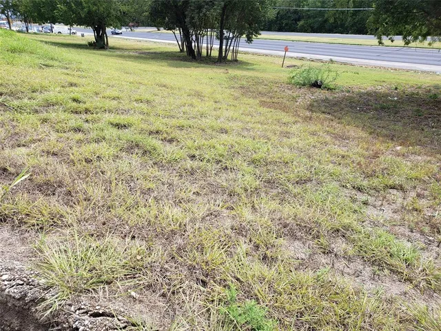 a view of a swimming pool with a yard