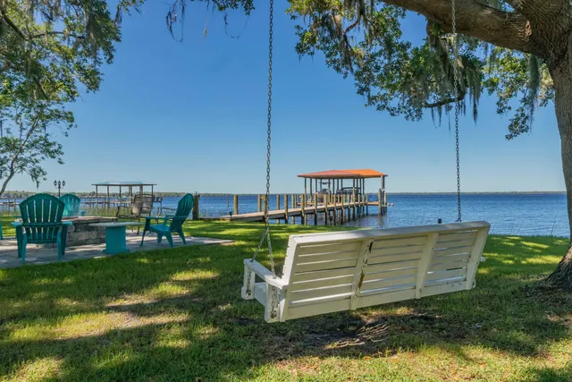 a view of a chair and table on the garden