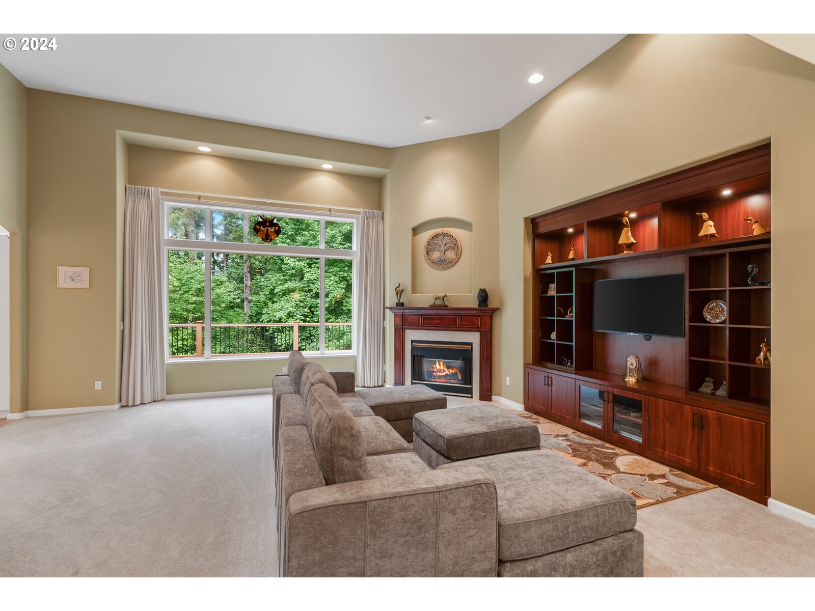 31500 Northwest 13th Avenue Ridgefield, WA 98642 - Photo 15 of 48 a living room with furniture a flat screen tv and floor to ceiling window