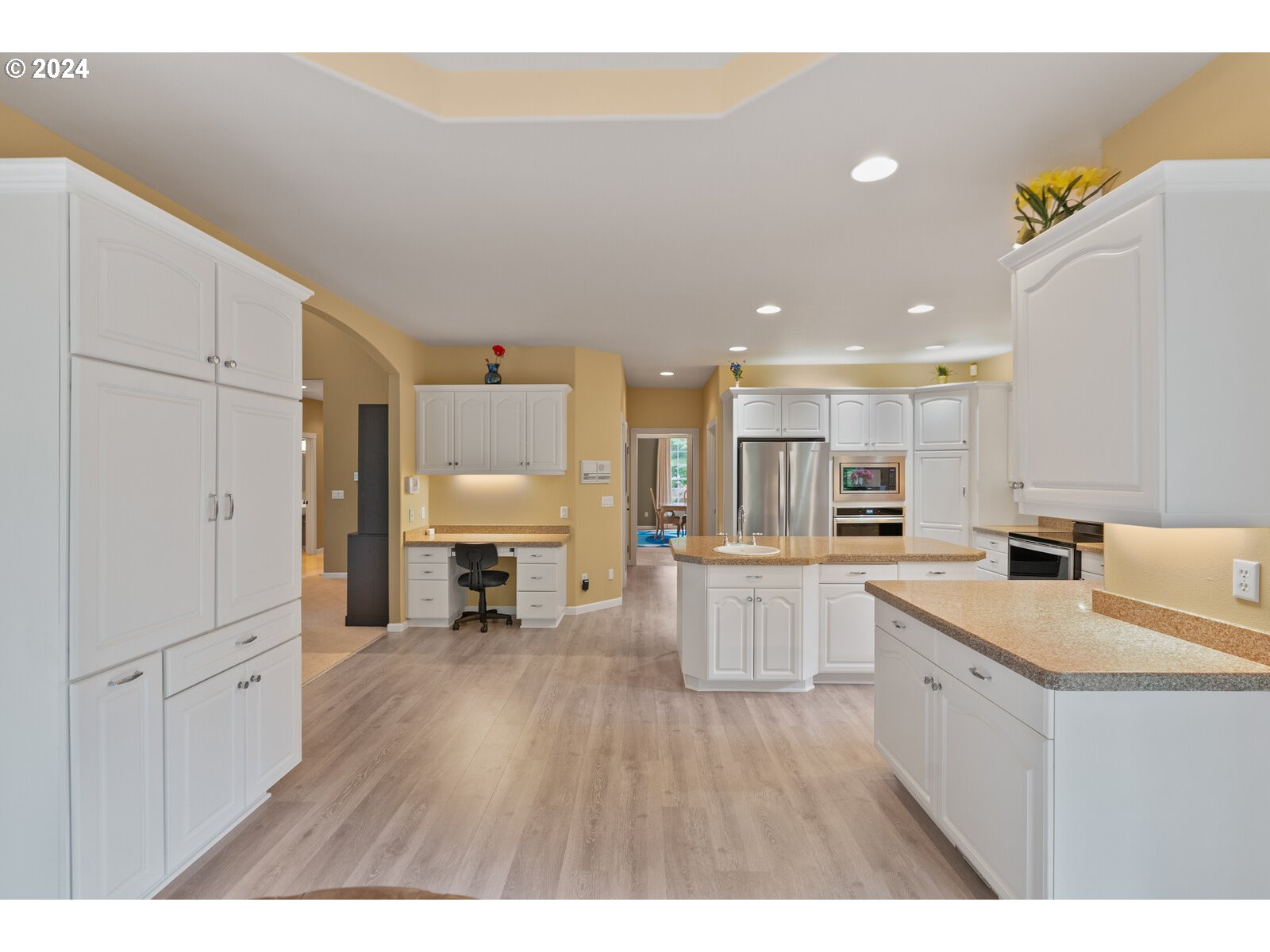 31500 Northwest 13th Avenue Ridgefield, WA 98642 - Photo 21 of 48 a open kitchen with white cabinets and wooden floor