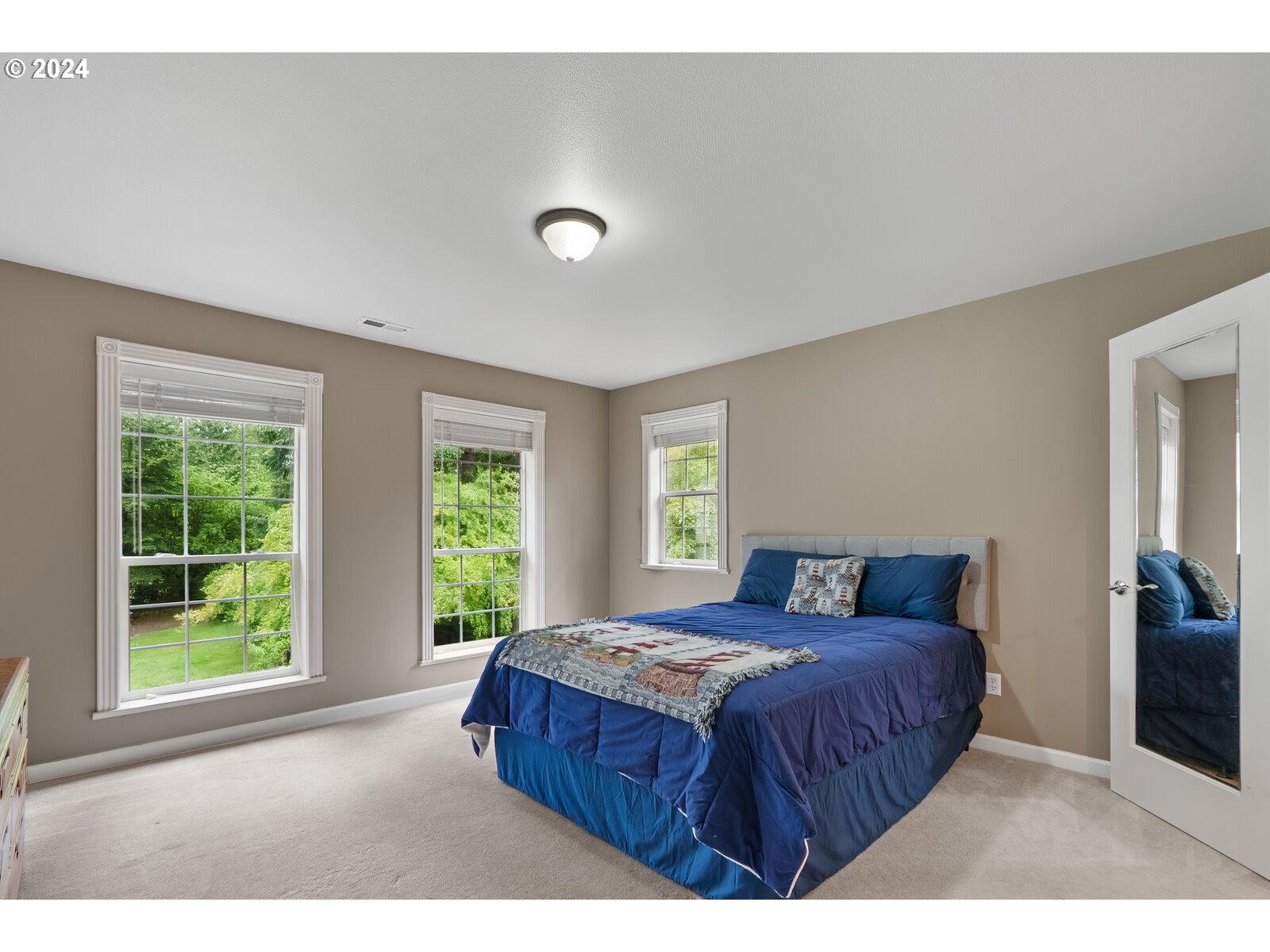 31500 Northwest 13th Avenue Ridgefield, WA 98642 - Photo 35 of 48 a bedroom with a bed and a large window