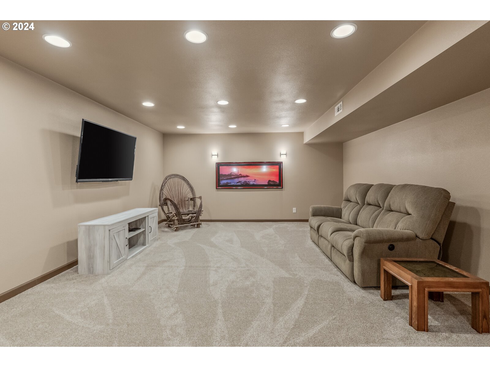 31500 Northwest 13th Avenue Ridgefield, WA 98642 - Photo 41 of 48 a living room with furniture and a flat screen tv