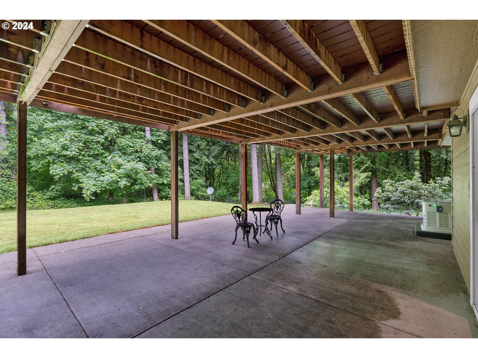 31500 Northwest 13th Avenue Ridgefield, WA 98642 - Photo 43 of 48 a view of a backyard with table and chairs with wooden floor