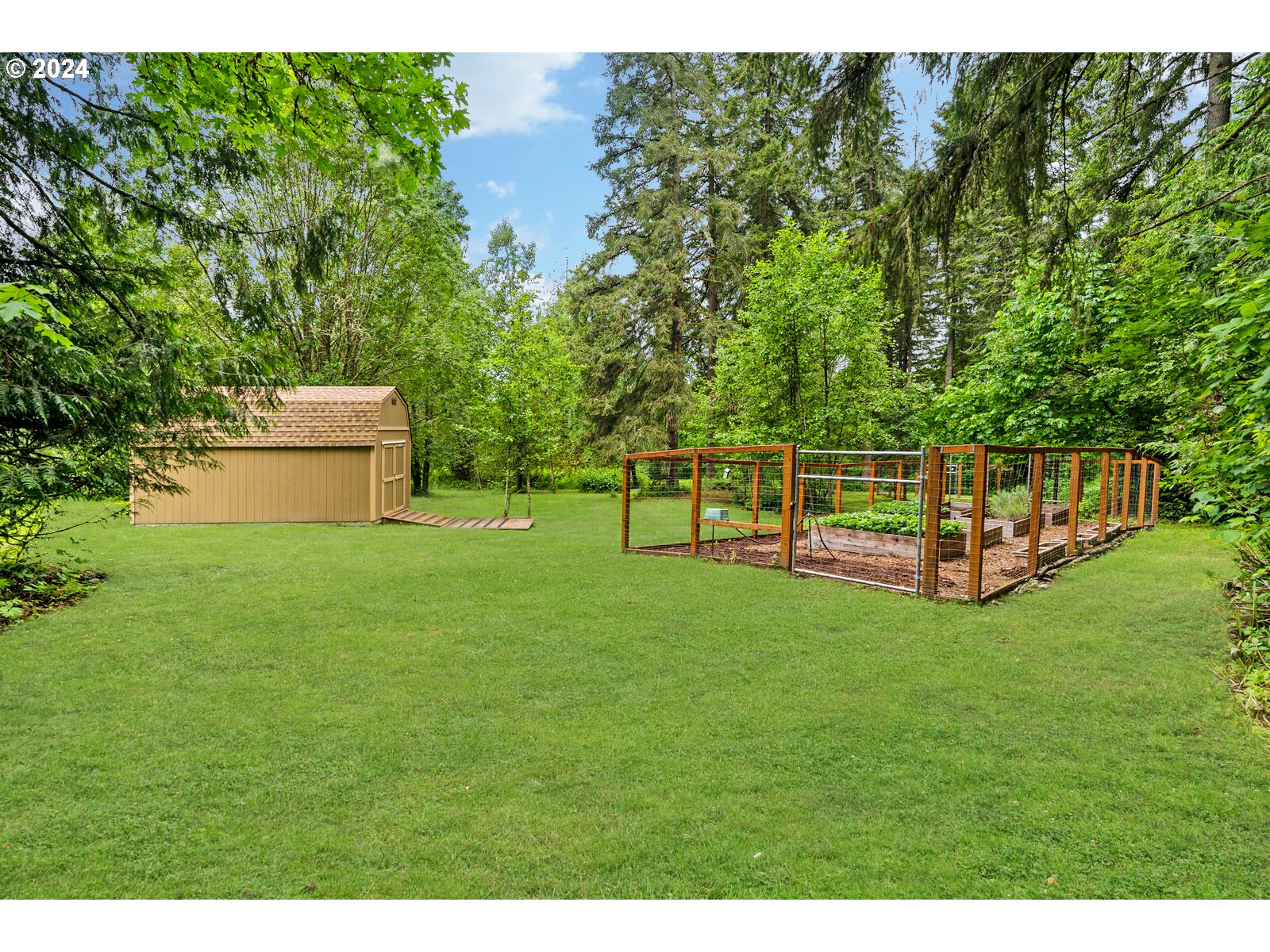 31500 Northwest 13th Avenue Ridgefield, WA 98642 - Photo 45 of 48 a view of a wooden deck and a garden