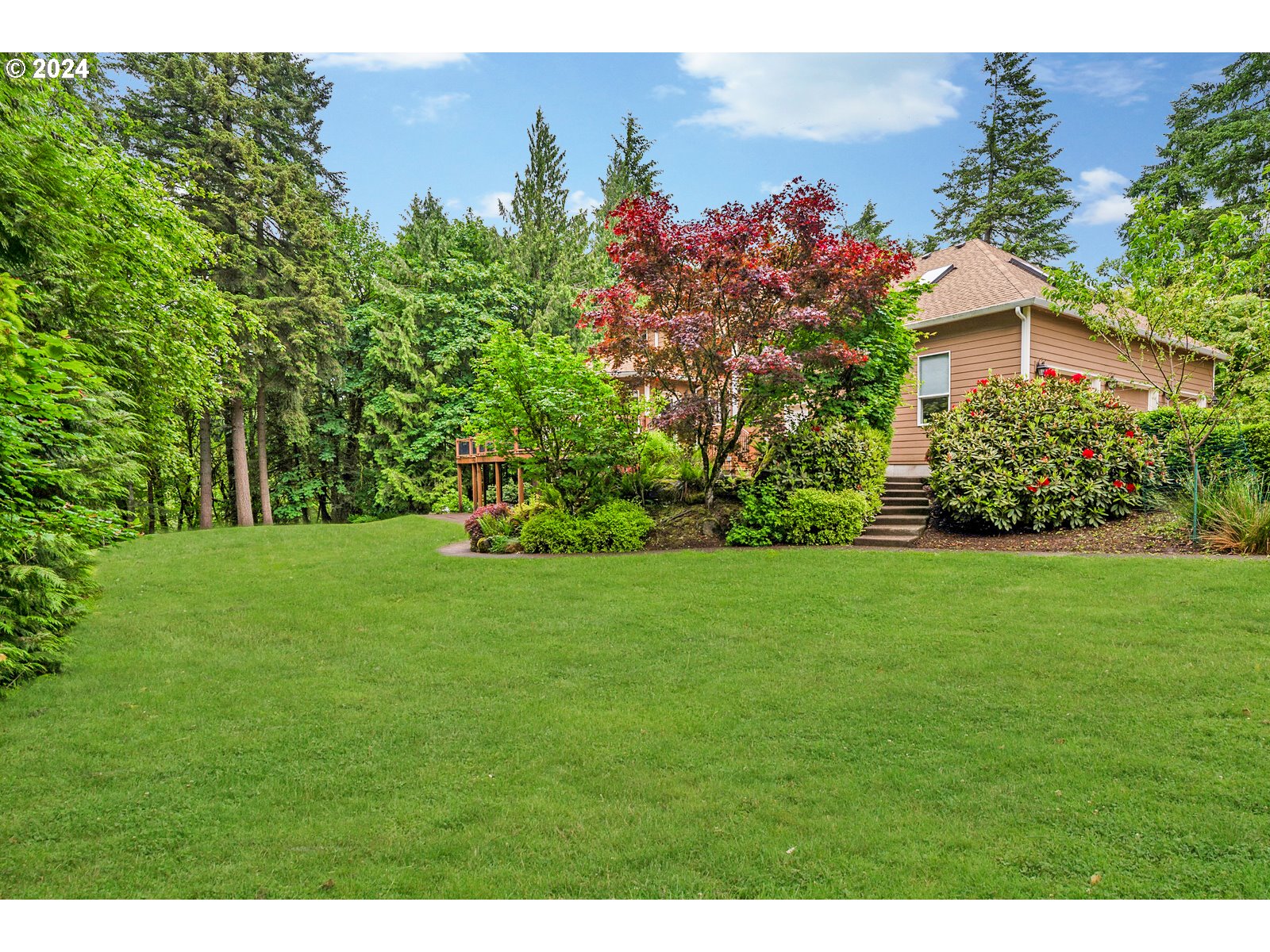 31500 Northwest 13th Avenue Ridgefield, WA 98642 - Photo 6 of 48 a front view of a house with a yard