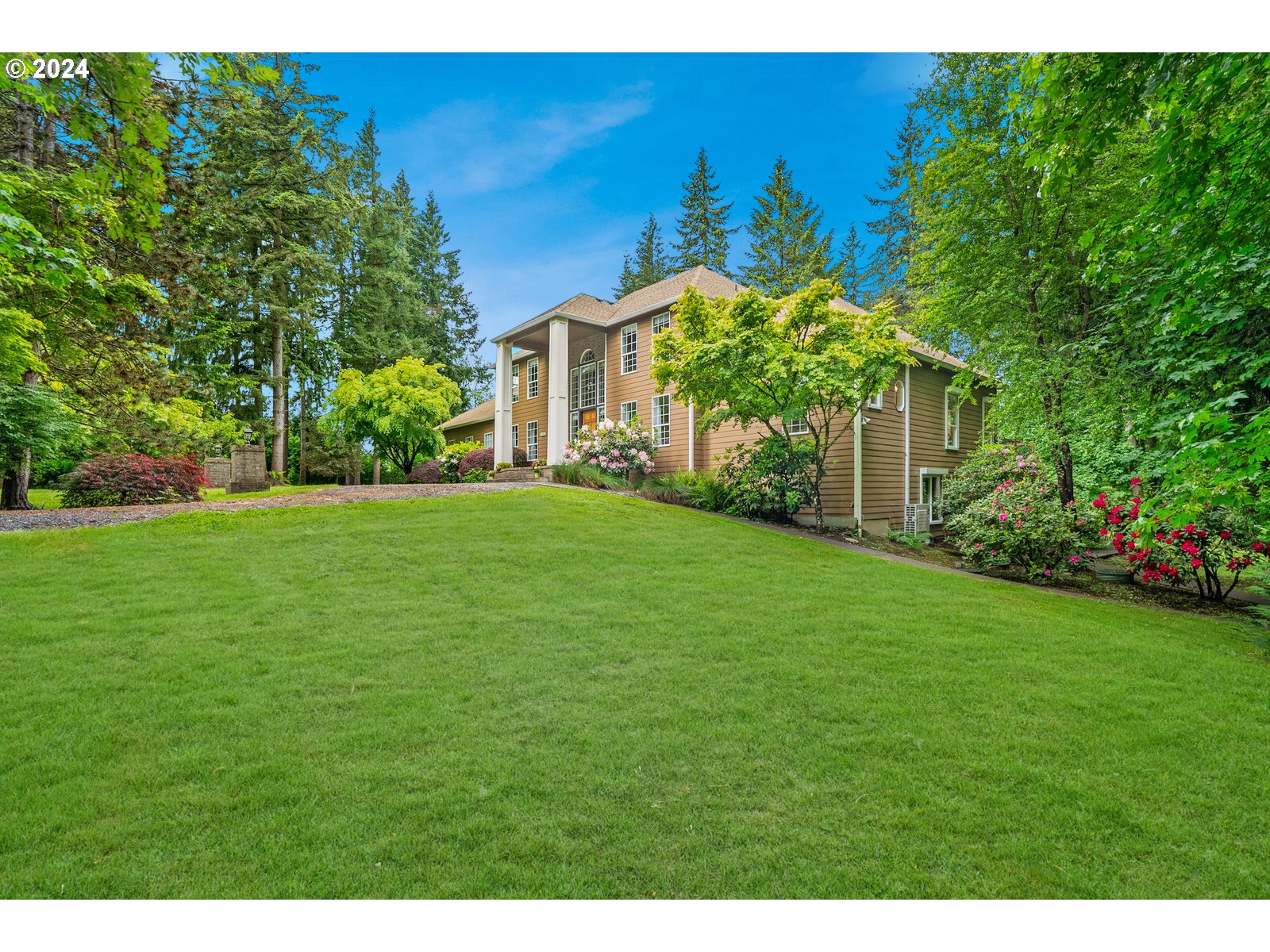 31500 Northwest 13th Avenue Ridgefield, WA 98642 - Photo 9 of 48 a yellow house with a yard