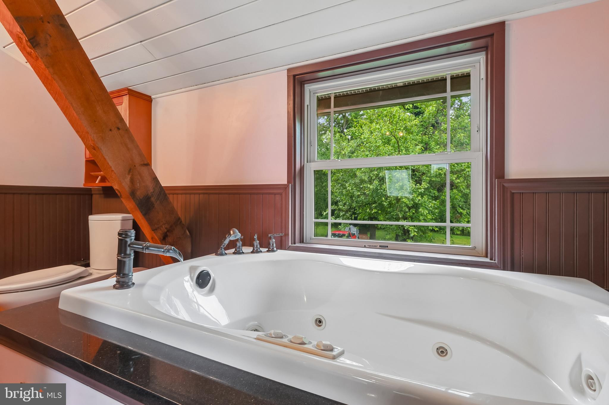 116 Mulberry Street Delran, NJ 08075 - Photo 17 of 32 a bathroom with a bathtub and next to a window