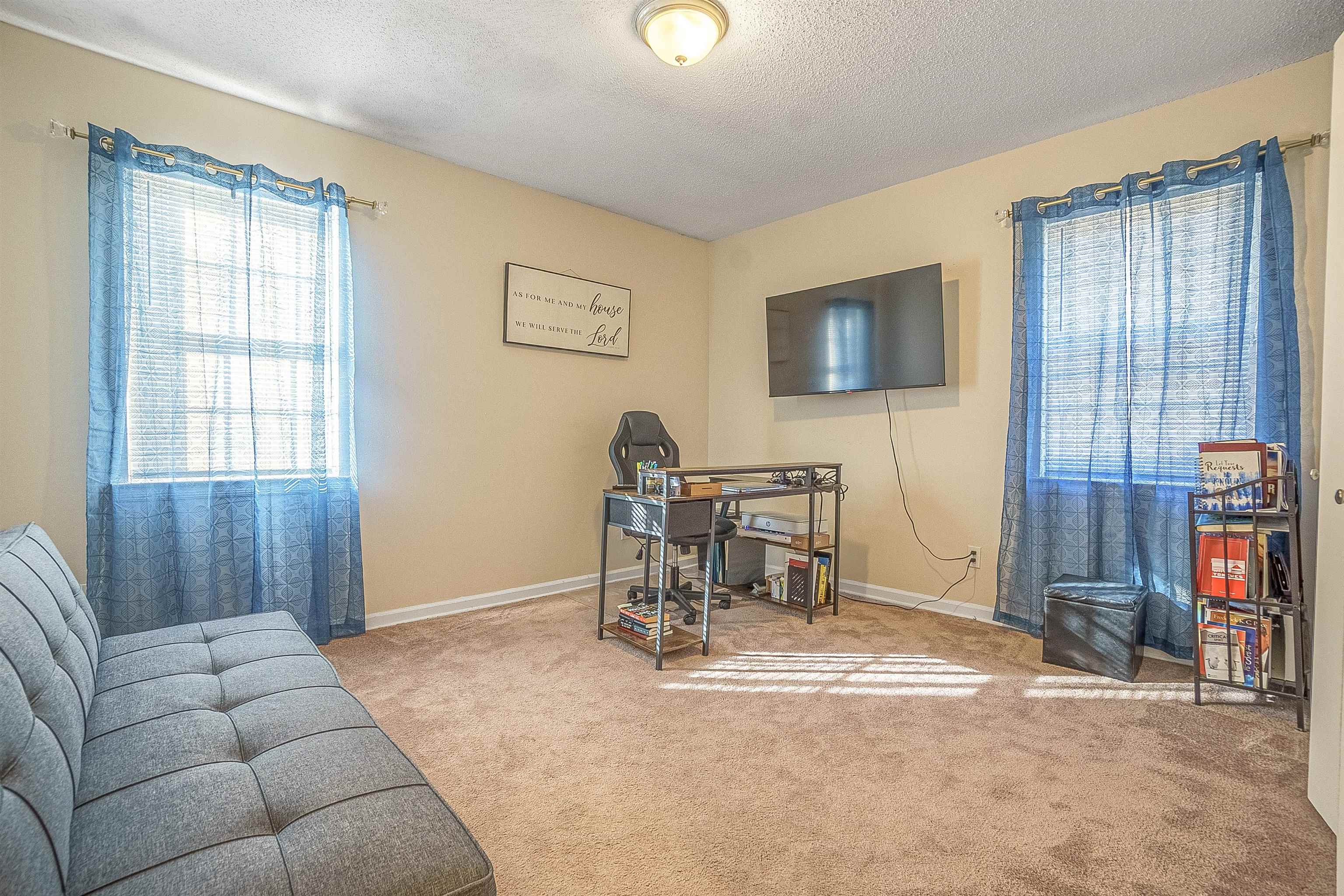 3467 Fox Meadows Road Memphis, TN 38115 - Photo 12 of 15 Office area with light carpet and a textured ceiling