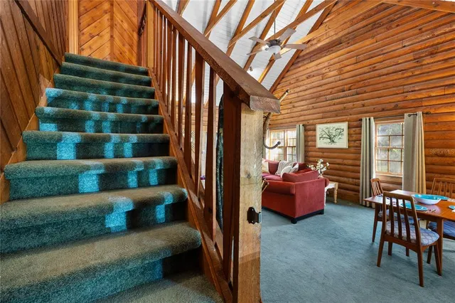 a view of a backyard with swimming pool