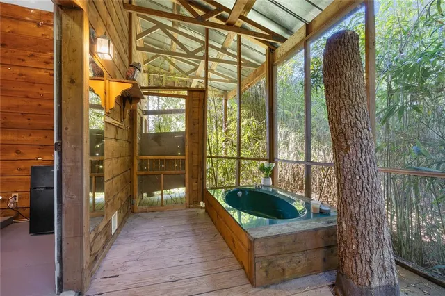 a view of a park with a bench in front of house