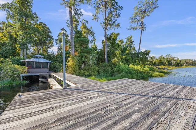 an aerial view of a house with outdoor space