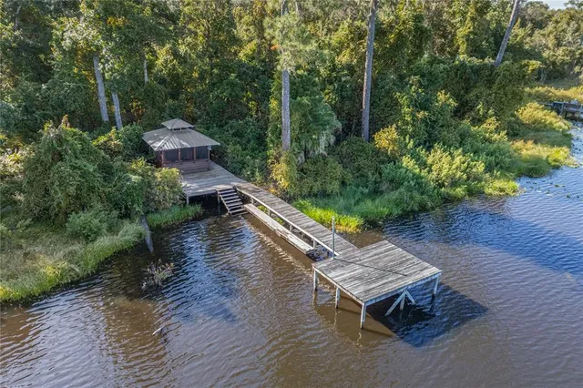 a aerial view of a house with a yard