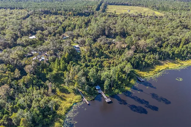 a view of a chair and table in backyard