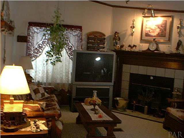 5440 Kauffman Road Milton, FL 32583 - Photo 18 of 22 Den with Gas Fireplace