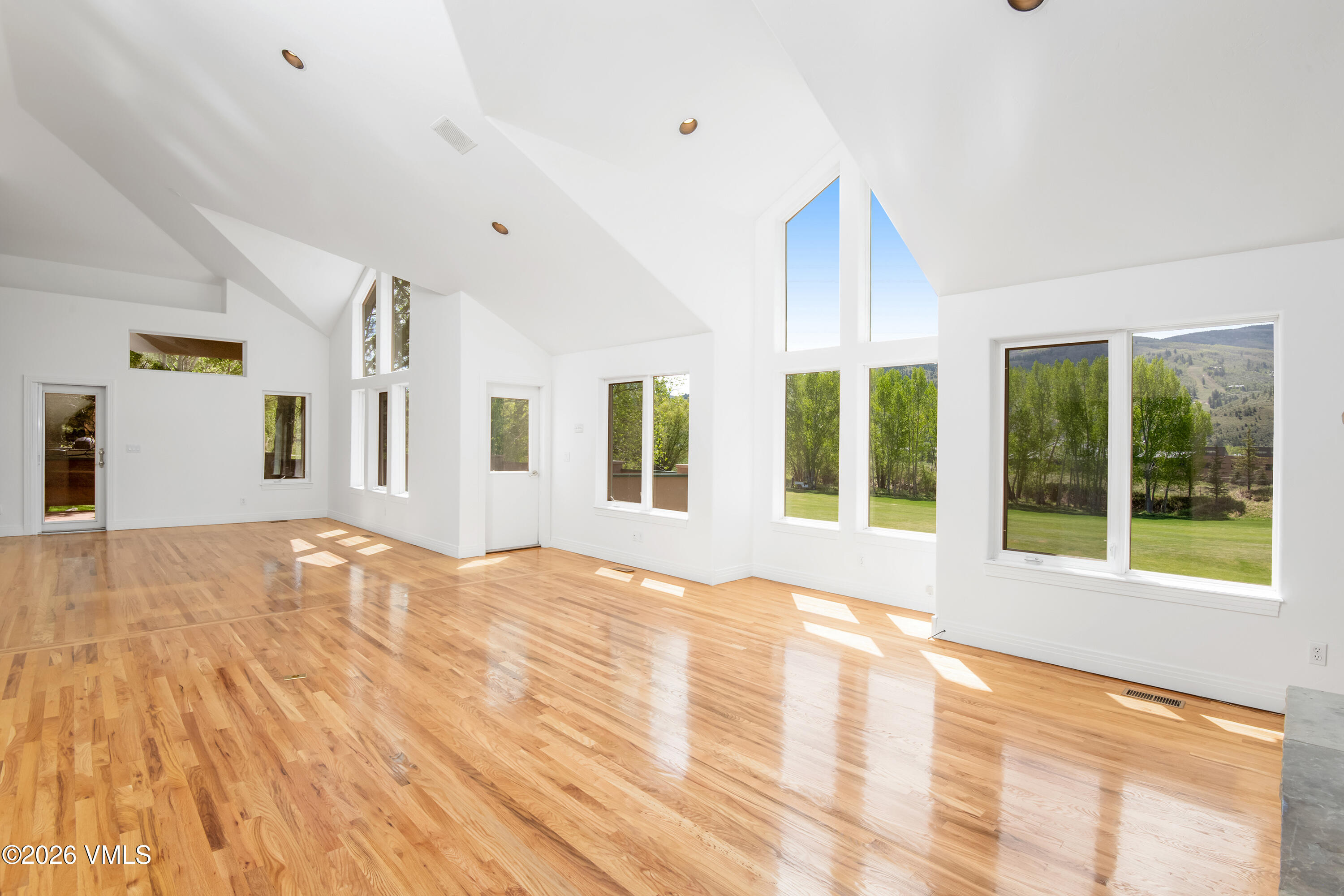 471 Rawhide Road Edwards, CO 81632 - Photo 8 of 51 a view of an empty room with a window and wooden floor