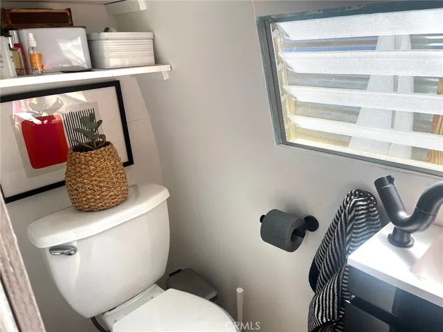 a bathroom with a toilet and a sink