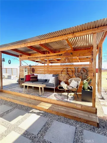a view of a swimming pool with sitting area